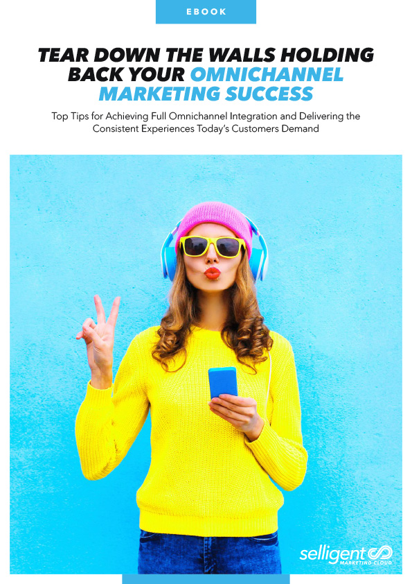 Thumbnail of a document entitled "Ebook: Tear Down The Walls Holding Back Your Omnichannel Marketing Success" featuring an image of a stylish woman wearing brightly colored neon colored clothing, a beanie, and headphones. The woman is posing with a peace sign and listening to music with a smile in front of a bright blue background.